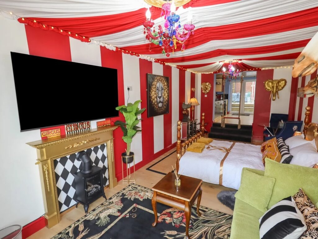 A retired nurse transformed a holiday home in Wales into a circus-themed retreat, complete with striped walls and vintage décor, delighting guests with its playful charm.