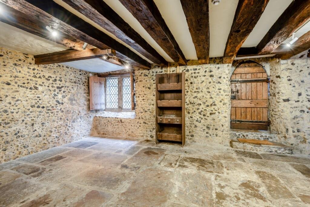 Historic Canterbury home where knights plotted to kill Thomas Becket hits market for £750,000 - features Norman undercroft, timber frame, and modern comforts.