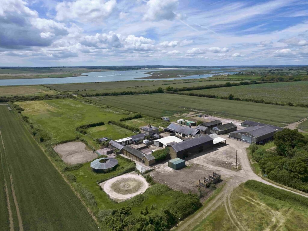 A £20m Georgian-style estate in Essex with 327 acres, indoor pool, vineyard potential and stunning river views offers a dream escape for wine lovers and investors.