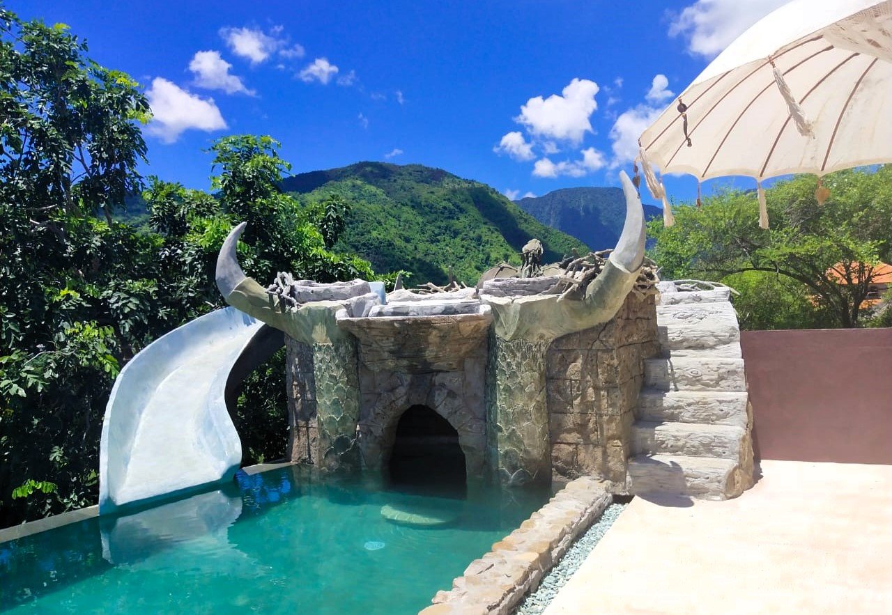 You can now rent the Dragon’s Nest Cottage in Bali on Airbnb for £60 a night – a fantasy stay with a rooftop pool, cave slide, and breathtaking views of sea and mountains.