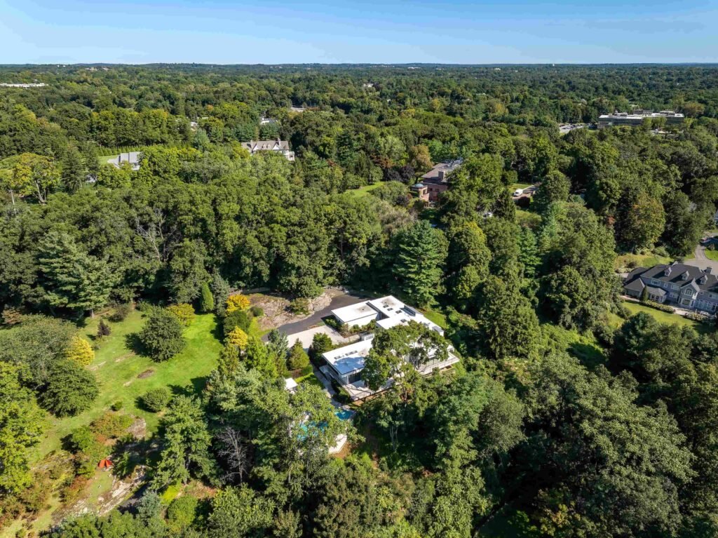 A luxury Rye home redesigned by Yale dean Deborah Berke is on sale for \$4.95m - featuring skylights, a heated pool, spa suite and award-winning architectural design.