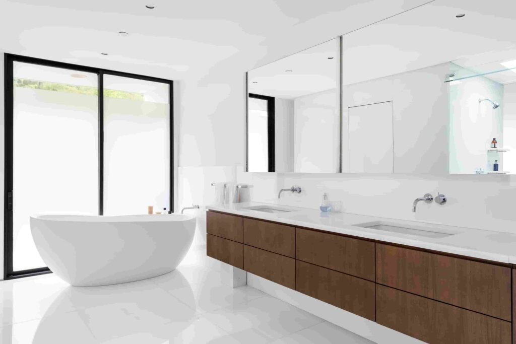 A luxury Rye home redesigned by Yale dean Deborah Berke is on sale for $4.95m - featuring skylights, a heated pool, spa suite and award-winning architectural design.