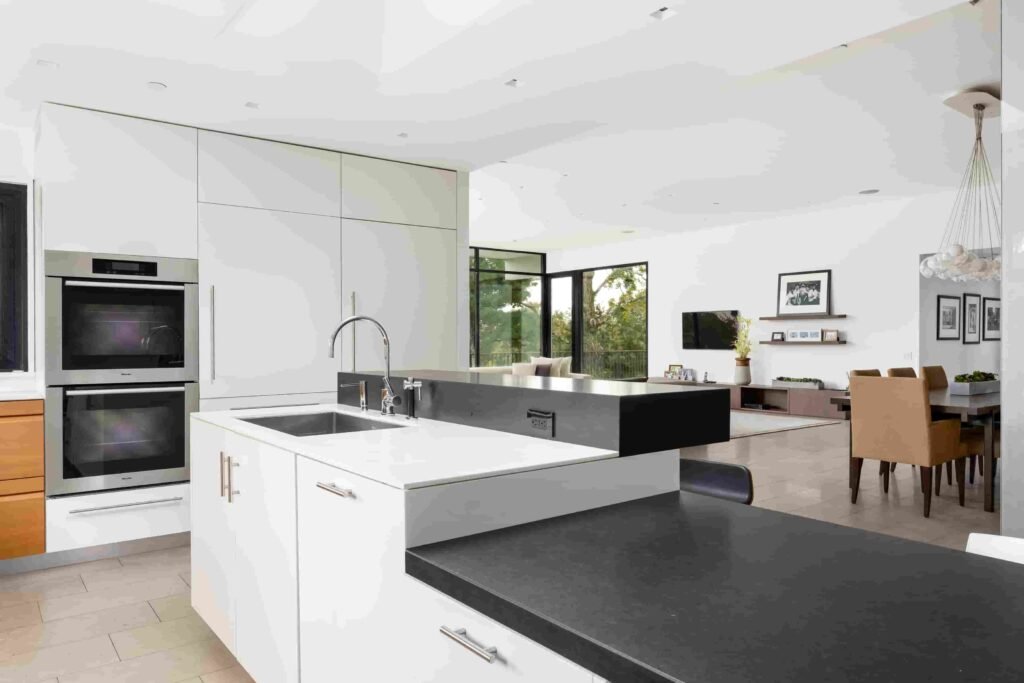 A luxury Rye home redesigned by Yale dean Deborah Berke is on sale for \$4.95m - featuring skylights, a heated pool, spa suite and award-winning architectural design.