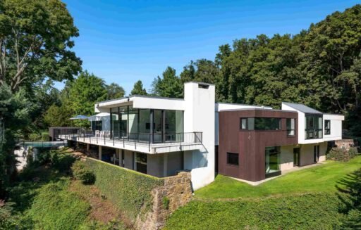 A luxury Rye home redesigned by Yale dean Deborah Berke is on sale for \$4.95m - featuring skylights, a heated pool, spa suite and award-winning architectural design.