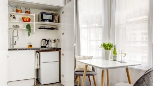 A £900-a-month seafront studio flat in Eastbourne features a kitchen in a cupboard, with a stove, sink and fridge squeezed in, and is only suitable for single tenants.