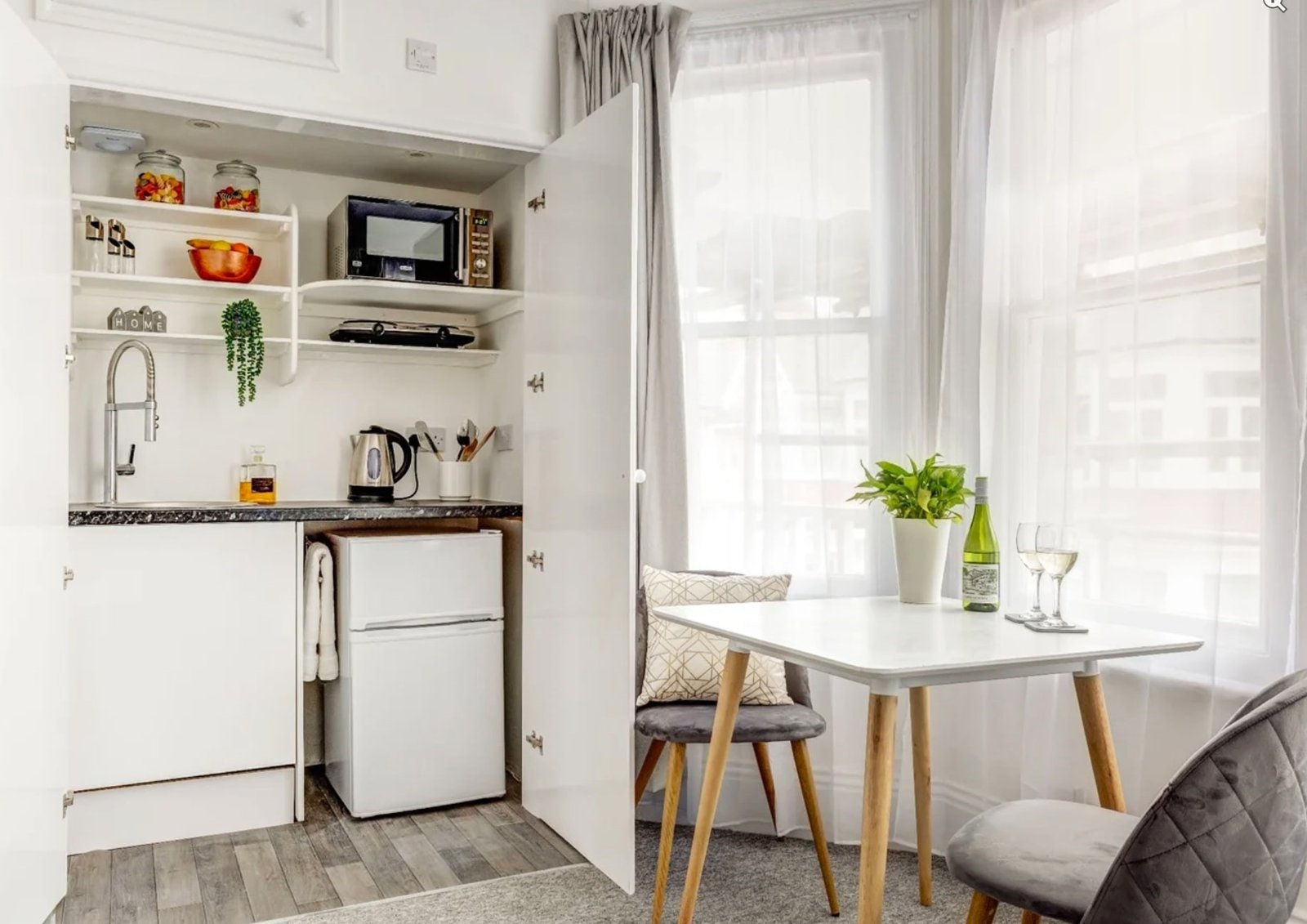 A £900-a-month seafront studio flat in Eastbourne features a kitchen in a cupboard, with a stove, sink and fridge squeezed in, and is only suitable for single tenants.
