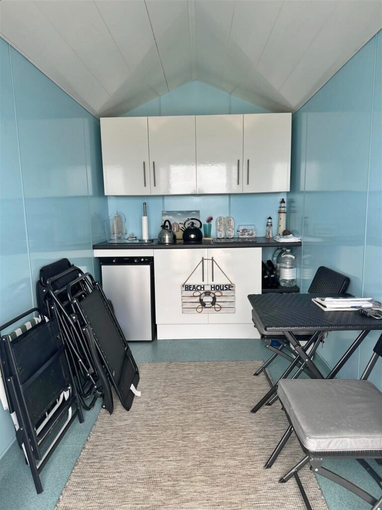 A tiny 13ft beach hut on Avon Beach, Dorset, with sea views and minimal facilities is on sale for £110,000 - offering a private summer spot despite no toilets or showers.