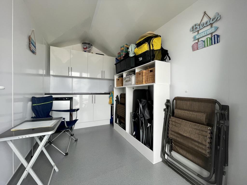 This £120,000 beach hut on Avon Beach offers stunning views and a kitchen but no toilet, leaving owners queuing for public loos just meters from the water’s edge.