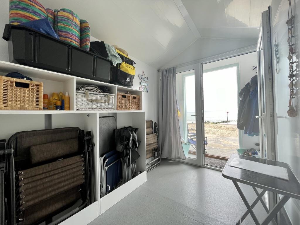 This £120,000 beach hut on Avon Beach offers stunning views and a kitchen but no toilet, leaving owners queuing for public loos just meters from the water’s edge.
