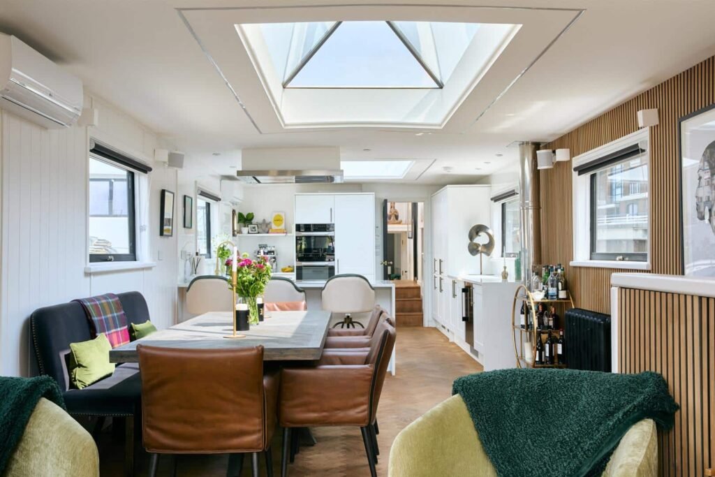 A stunning £1.5m Spitz barge in London with four en-suite bedrooms, panoramic views, and luxury interiors offers rare riverside living just minutes from Central London.