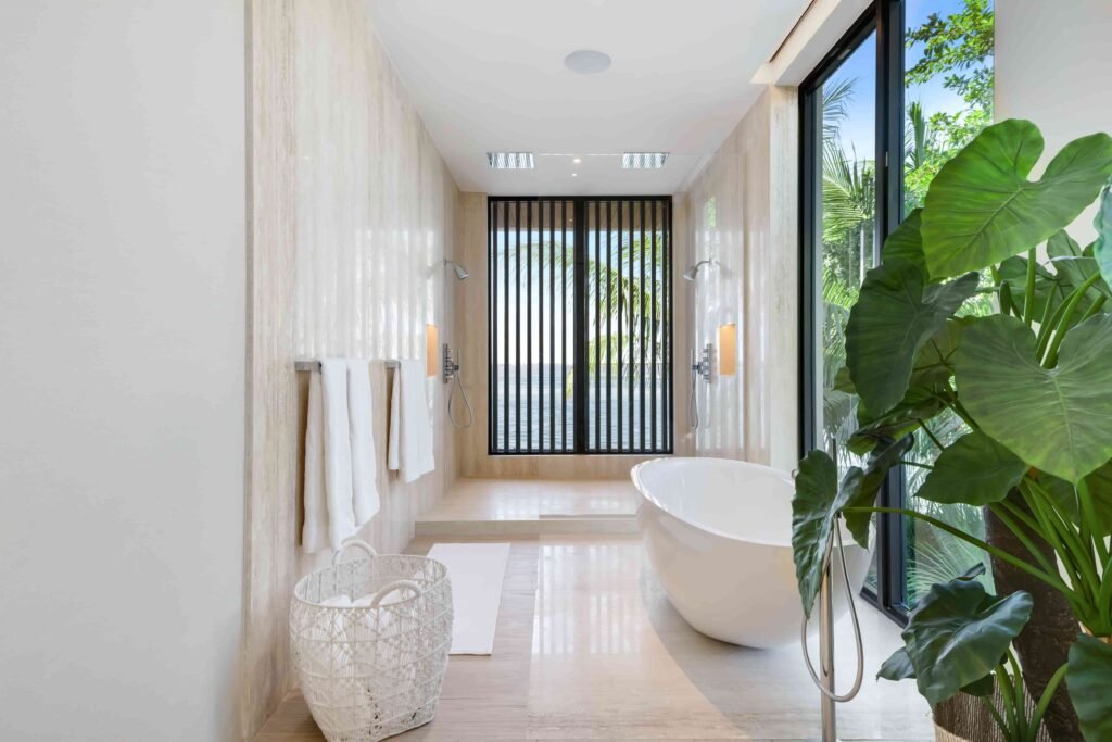 Eddie Irvine lists his £27.6m Miami estate with 6 bedrooms, rooftop views, a pool, boat lift, smart tech, and eco features just steps from Biscayne Bay’s waterfront.