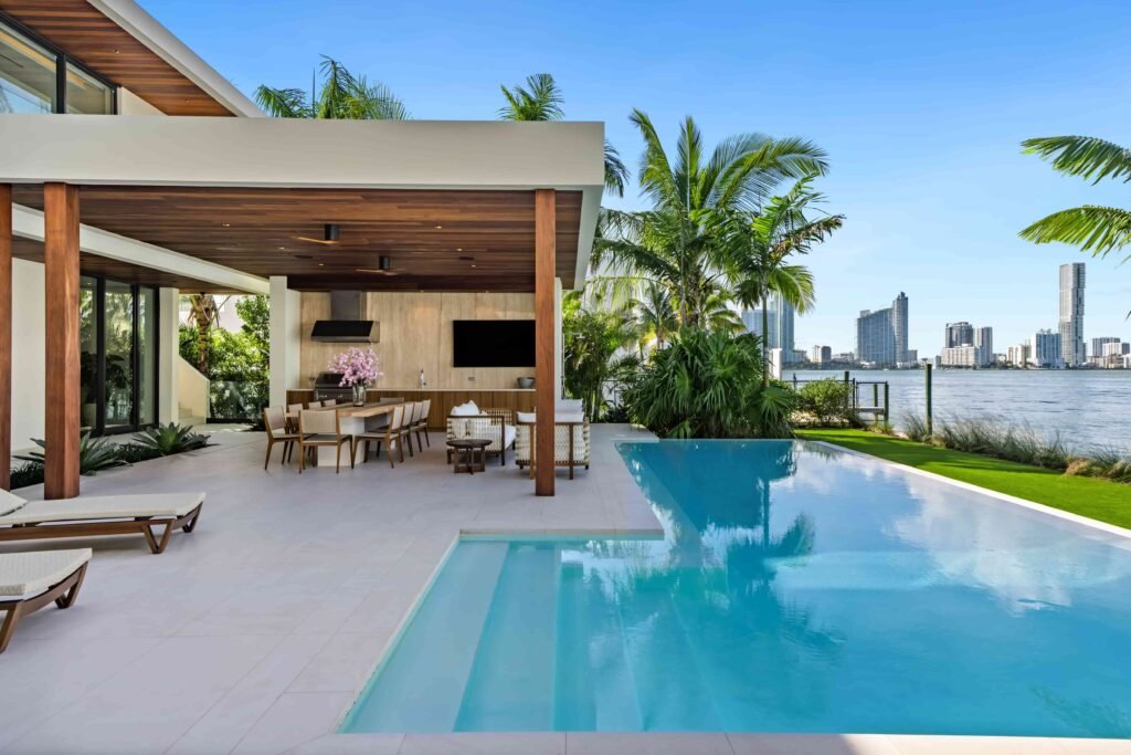 Eddie Irvine lists his £27.6m Miami estate with 6 bedrooms, rooftop views, a pool, boat lift, smart tech, and eco features just steps from Biscayne Bay’s waterfront.