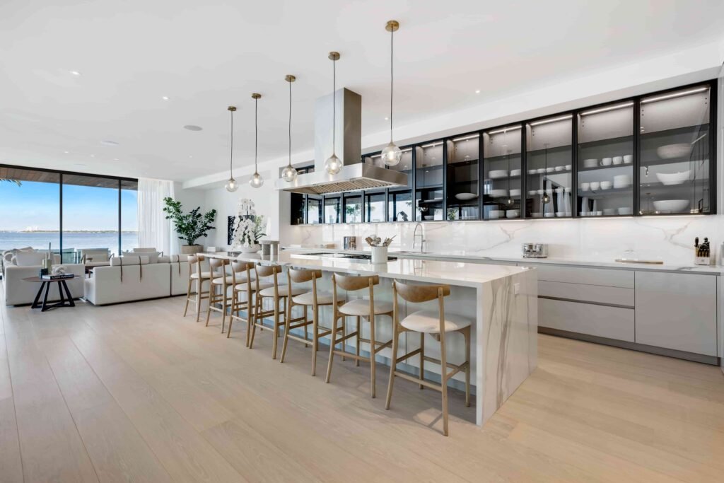Eddie Irvine lists his £27.6m Miami estate with 6 bedrooms, rooftop views, a pool, boat lift, smart tech, and eco features just steps from Biscayne Bay’s waterfront.