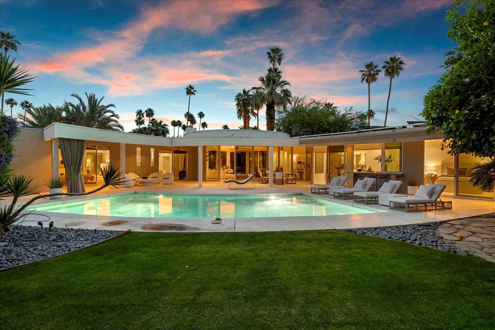 Loretta Young’s glamorous Palm Springs home, a mid-century modern masterpiece with curved walls, origami ceilings and a lush garden, is now listed for just under \$2.5 million.