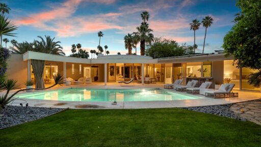 Loretta Young’s glamorous Palm Springs home, a mid-century modern masterpiece with curved walls, origami ceilings and a lush garden, is now listed for just under \$2.5 million.