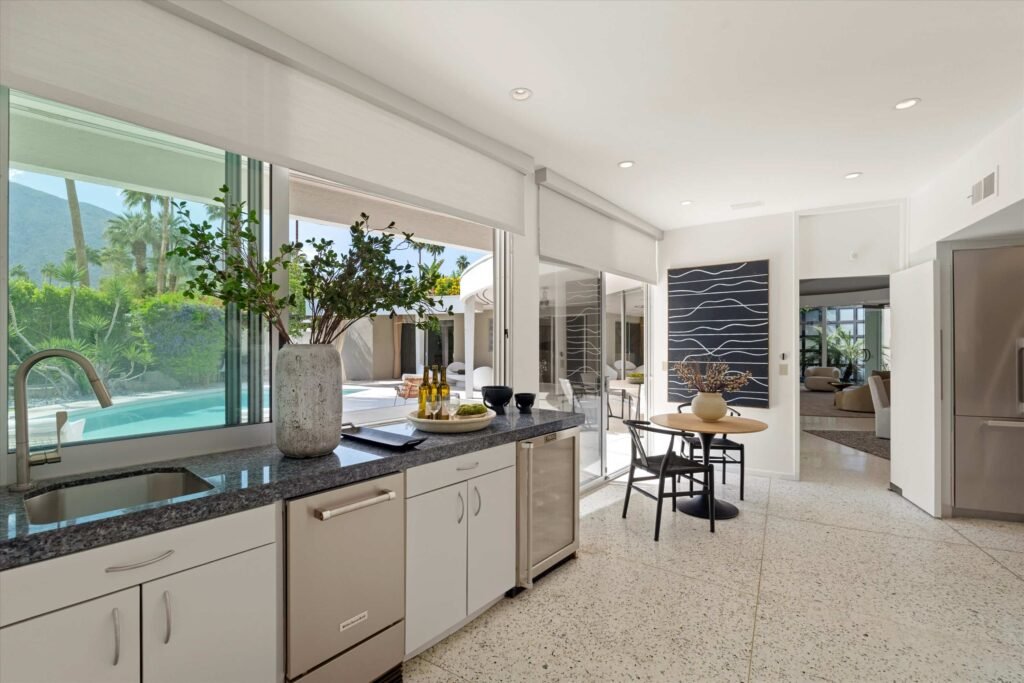 Loretta Young’s glamorous Palm Springs home, a mid-century modern masterpiece with curved walls, origami ceilings and a lush garden, is now listed for just under \$2.5 million.