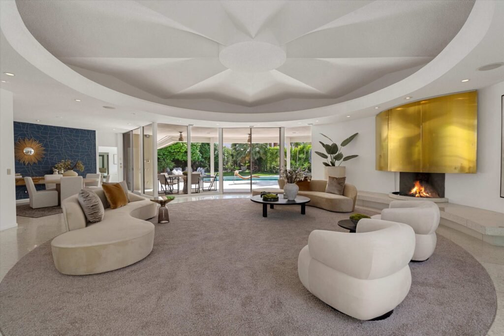 Loretta Young’s glamorous Palm Springs home, a mid-century modern masterpiece with curved walls, origami ceilings and a lush garden, is now listed for just under \$2.5 million.