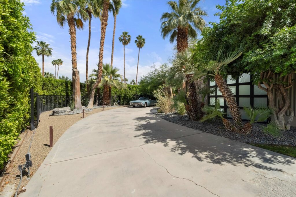 Loretta Young’s glamorous Palm Springs home, a mid-century modern masterpiece with curved walls, origami ceilings and a lush garden, is now listed for just under \$2.5 million.