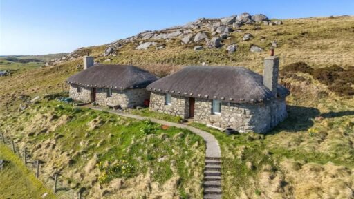 Twin thatched cottages on Scotland's Isle of Coll are for sale at £420,000, offering ocean views, shared gardens and rustic charm near where Kate Winslet owns a home.