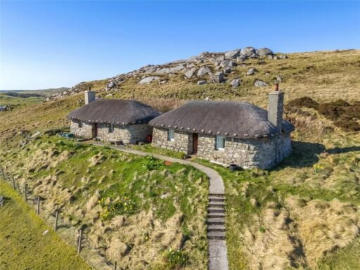 Twin thatched cottages on Scotland's Isle of Coll are for sale at £420,000, offering ocean views, shared gardens and rustic charm near where Kate Winslet owns a home.