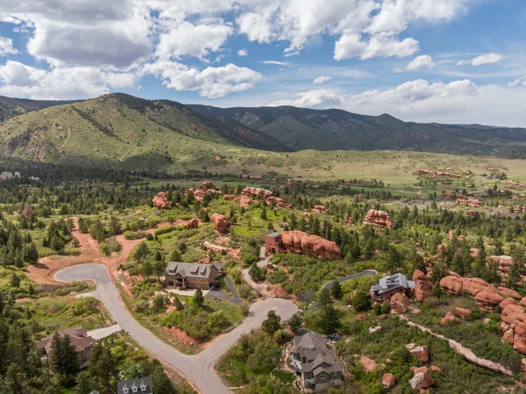 The \$1 million Rock House in Colorado blends nature and design, built into a 45-foot red rock monolith with dramatic views, unique interiors and prehistoric charm.