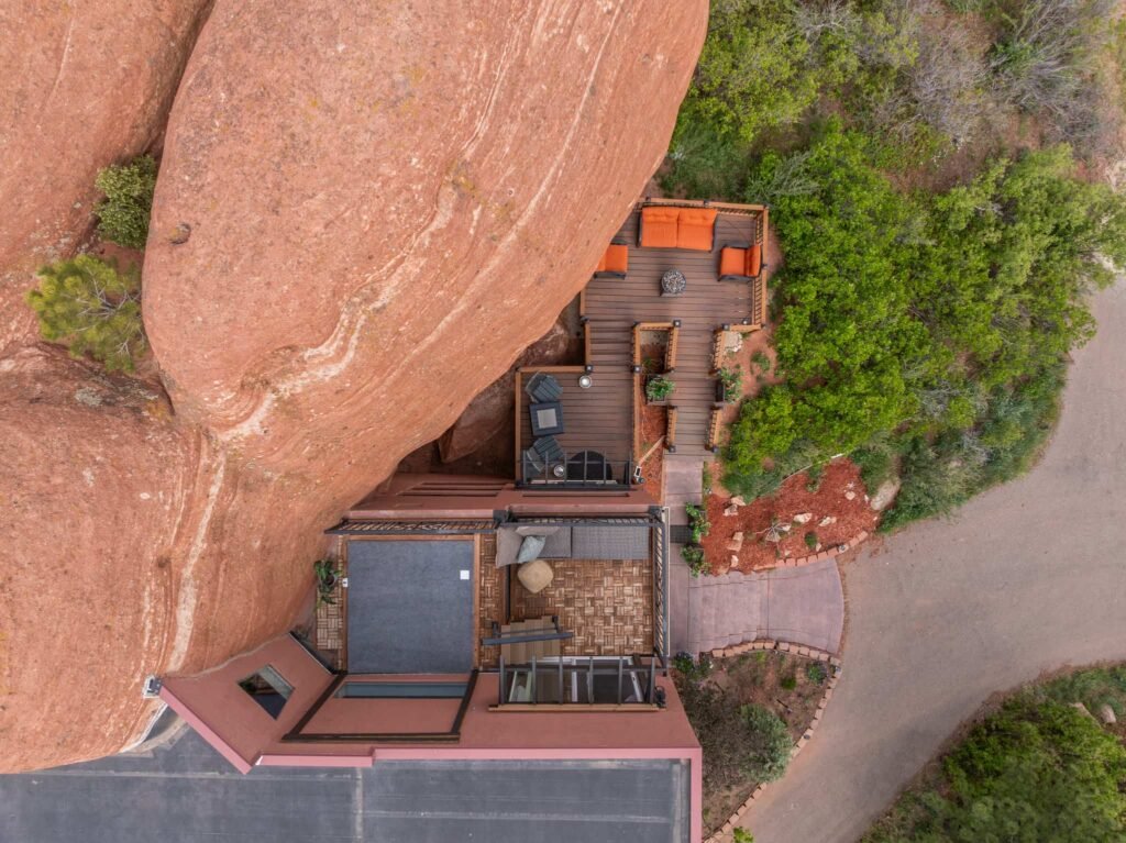 The \$1 million Rock House in Colorado blends nature and design, built into a 45-foot red rock monolith with dramatic views, unique interiors and prehistoric charm.
