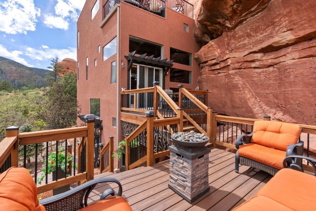 The \$1 million Rock House in Colorado blends nature and design, built into a 45-foot red rock monolith with dramatic views, unique interiors and prehistoric charm.