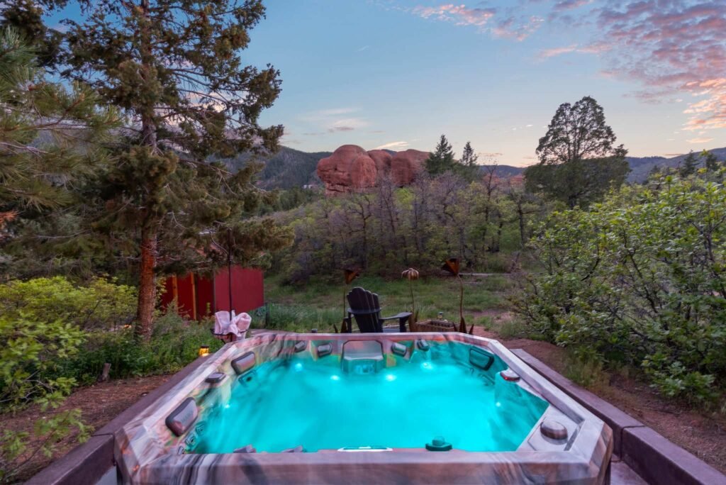 The \$1 million Rock House in Colorado blends nature and design, built into a 45-foot red rock monolith with dramatic views, unique interiors and prehistoric charm.
