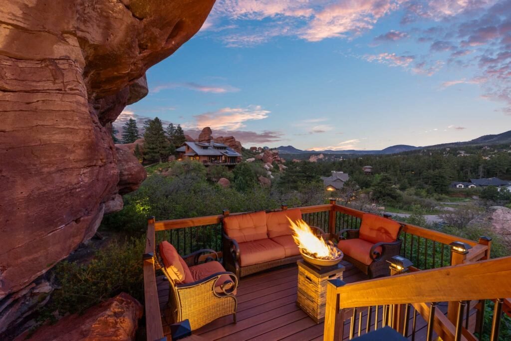 The \$1 million Rock House in Colorado blends nature and design, built into a 45-foot red rock monolith with dramatic views, unique interiors and prehistoric charm.