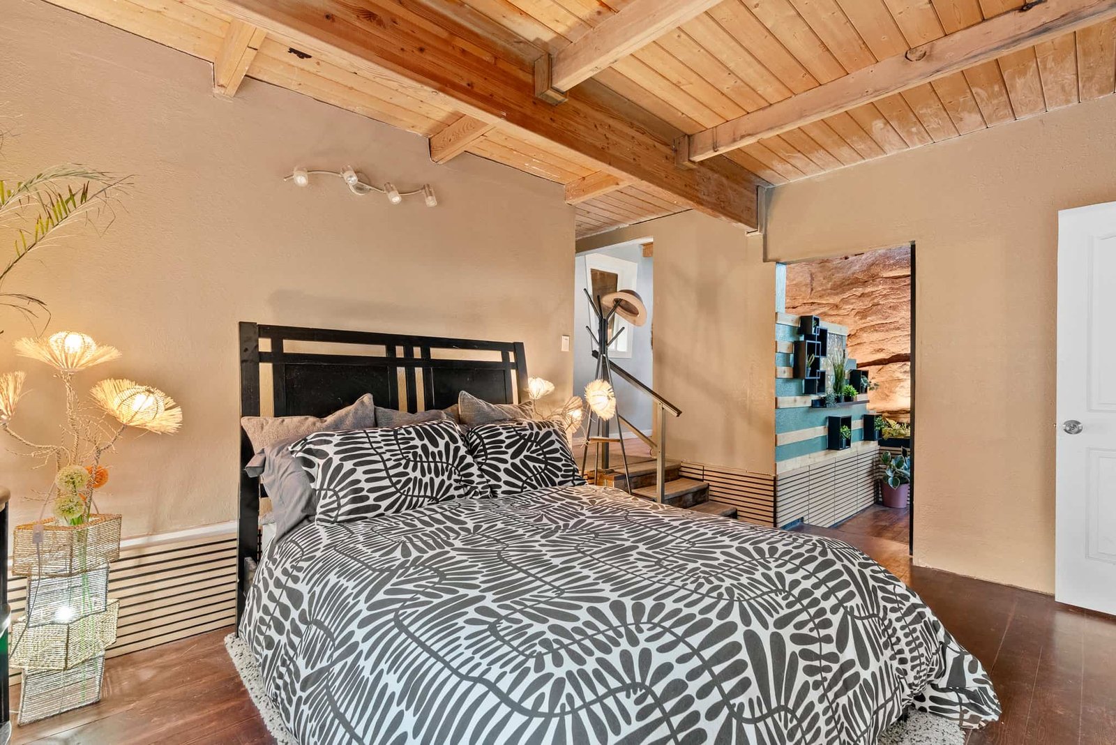 The \$1 million Rock House in Colorado blends nature and design, built into a 45-foot red rock monolith with dramatic views, unique interiors and prehistoric charm.