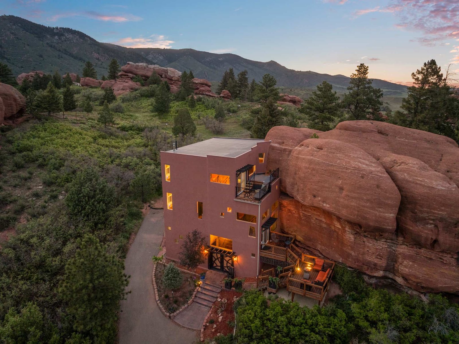 The \$1 million Rock House in Colorado blends nature and design, built into a 45-foot red rock monolith with dramatic views, unique interiors and prehistoric charm.
