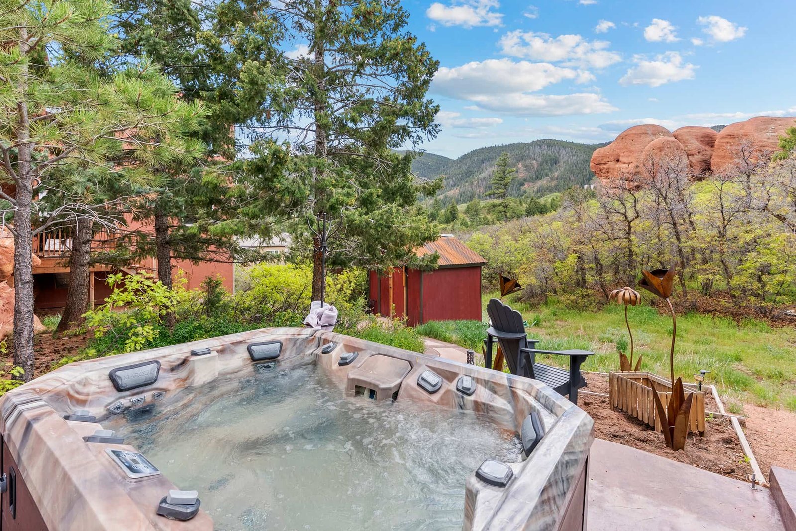 The \$1 million Rock House in Colorado blends nature and design, built into a 45-foot red rock monolith with dramatic views, unique interiors and prehistoric charm.