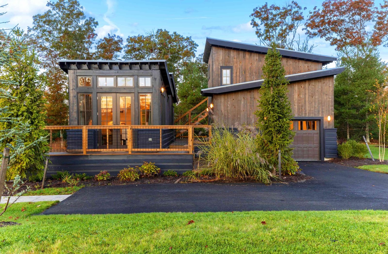 Tiny home in luxury Rhode Island community listed at \$850K offers golf, tennis, spa, fine dining and nature access with modern design, high-end finishes and full services.