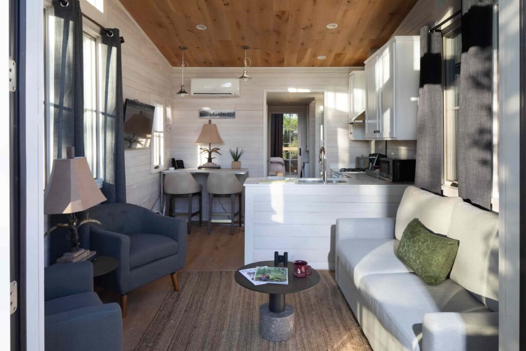 Tiny home in luxury Rhode Island community listed at \$850K offers golf, tennis, spa, fine dining and nature access with modern design, high-end finishes and full services.