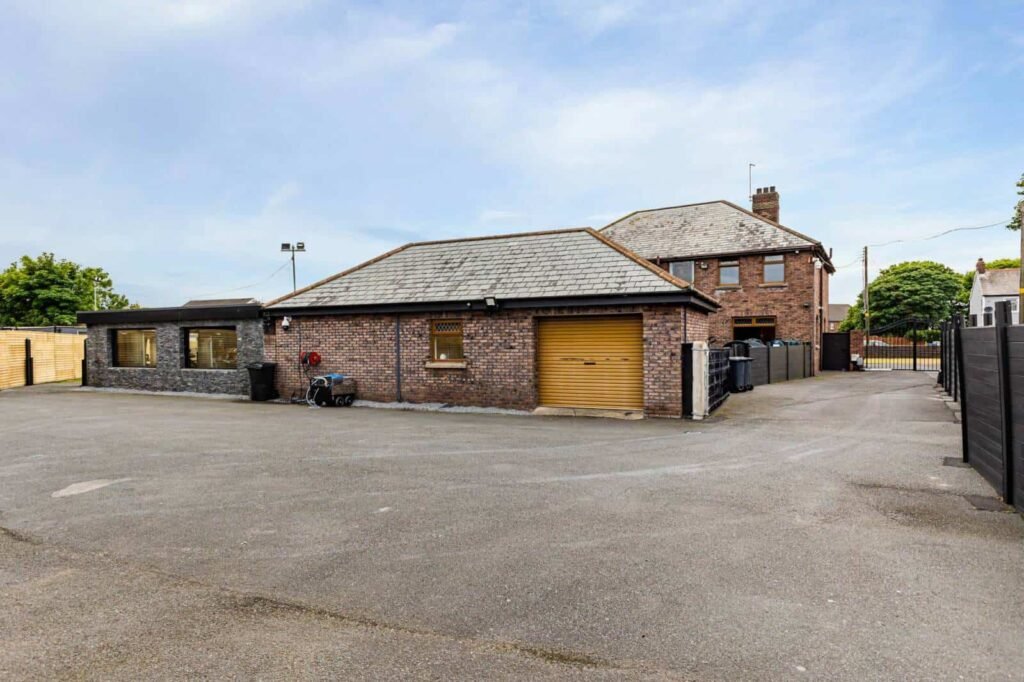 A five-bed Northern Ireland home with a full-size seven-a-side football pitch, gym, dog shower and luxe interiors is on sale for £435,000 offering fun and privacy.