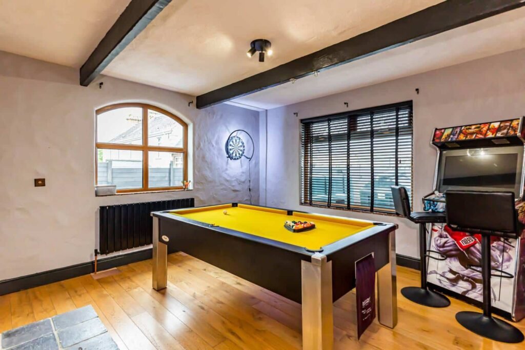 A five-bed Northern Ireland home with a full-size seven-a-side football pitch, gym, dog shower and luxe interiors is on sale for £435,000 offering fun and privacy.