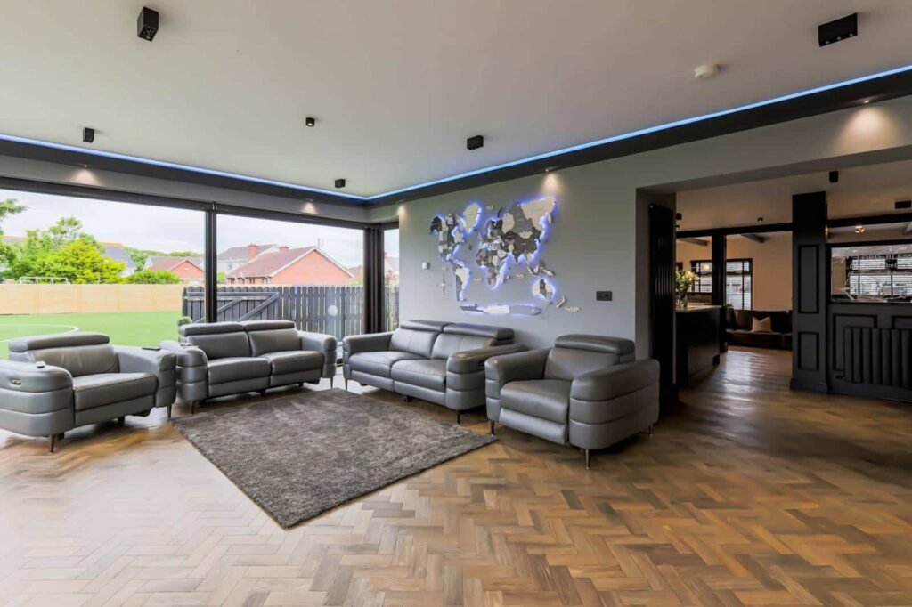 A five-bed Northern Ireland home with a full-size seven-a-side football pitch, gym, dog shower and luxe interiors is on sale for £435,000 offering fun and privacy.