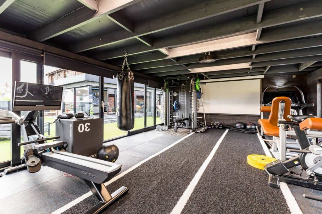 A five-bed Northern Ireland home with a full-size seven-a-side football pitch, gym, dog shower and luxe interiors is on sale for £435,000 offering fun and privacy.