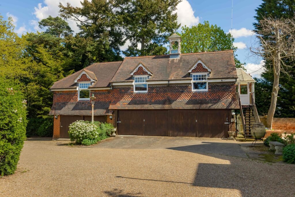 Stanley Kubrick’s former Elstree mansion with a pool, lush gardens, and film history is for sale at £6.95m, just in time for London’s sizzling summer heatwave.