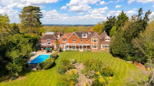 Stanley Kubrick’s former Elstree mansion with a pool, lush gardens, and film history is for sale at £6.95m, just in time for London’s sizzling summer heatwave.