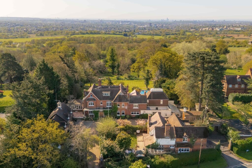 Stanley Kubrick’s former Elstree mansion with a pool, lush gardens, and film history is for sale at £6.95m, just in time for London’s sizzling summer heatwave.