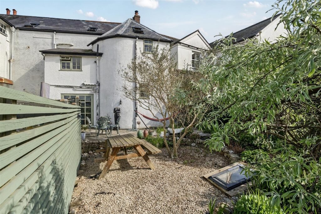 A Georgian townhouse in Devon with a secret tunnel, wine store, and historic well is on the market for £475,000, offering charm, character, and a touch of mystery.