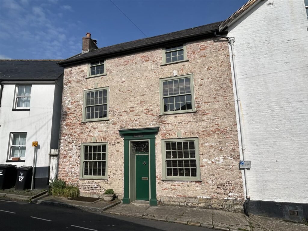 A Georgian townhouse in Devon with a secret tunnel, wine store, and historic well is on the market for £475,000, offering charm, character, and a touch of mystery.