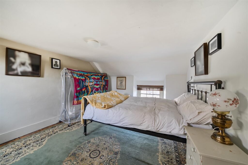 A Georgian townhouse in Devon with a secret tunnel, wine store, and historic well is on the market for £475,000, offering charm, character, and a touch of mystery.