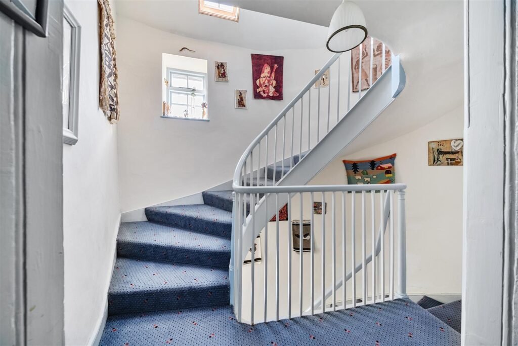 A Georgian townhouse in Devon with a secret tunnel, wine store, and historic well is on the market for £475,000, offering charm, character, and a touch of mystery.