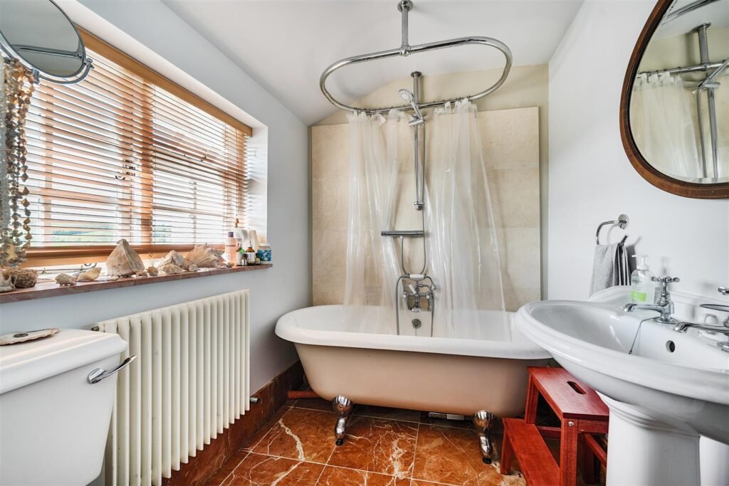 A Georgian townhouse in Devon with a secret tunnel, wine store, and historic well is on the market for £475,000, offering charm, character, and a touch of mystery.