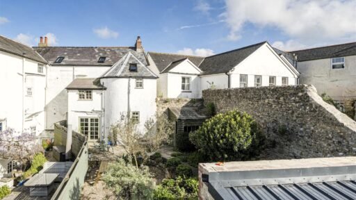A Georgian townhouse in Devon with a secret tunnel, wine store, and historic well is on the market for £475,000, offering charm, character, and a touch of mystery.
