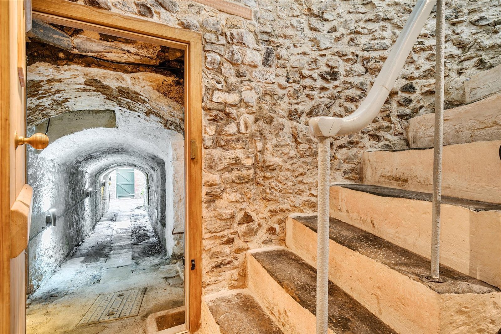 A Georgian townhouse in Devon with a secret tunnel, wine store, and historic well is on the market for £475,000, offering charm, character, and a touch of mystery.