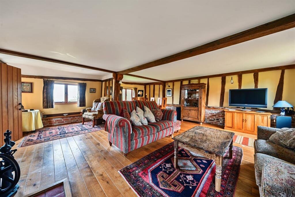 This £945k East Sussex barn home has 3 beds, a vineyard, 12.5 acres, stunning valley views and its own private airstrip and hangar for microlight aircraft.