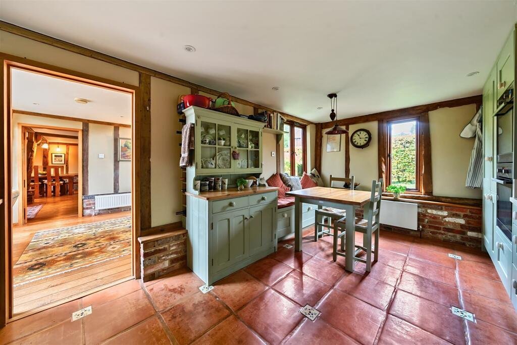 This £945k East Sussex barn home has 3 beds, a vineyard, 12.5 acres, stunning valley views and its own private airstrip and hangar for microlight aircraft.
